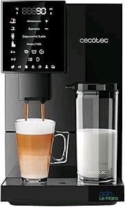 une photo d'une machine à café avec un verre de lait posé devant