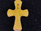 an image of a gold cross with the word jesus on it