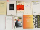 a lot of books that are sitting on a table