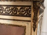 a picture of a mirror on a cabinet in a room
