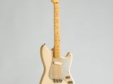 a white electric guitar hanging from the ceiling