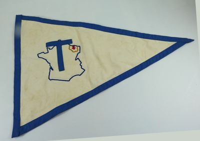 a close up of a pennant with a cross on it