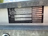 a sign on the back of a truck that says western
