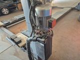 a machine that is sitting on a table in a garage