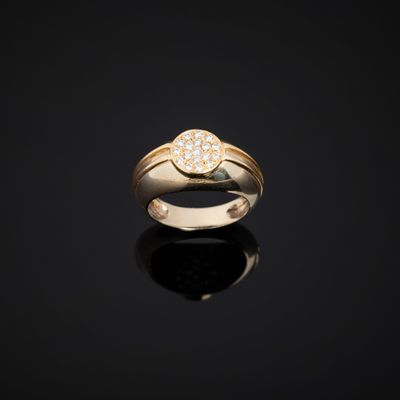 an 18k yellow gold ring set with a round brilliant cut diamond