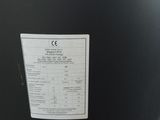 an image of a large black barrel with a price label on it