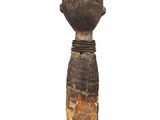 an image of a wooden sculpture of a person with a hat on it ' s head