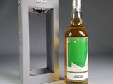 a bottle of wine that is sitting next to a box