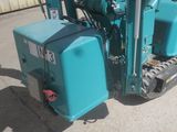 a small machine that is sitting outside of a building