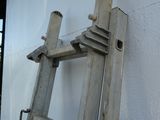 a ladder leaning against a wall on the side of a building