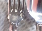 a fork and a spoon sitting on a table