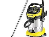 un aspirateur jaune et noir muni d'une poignée noire