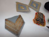 several pieces of cloth are laid out on a table