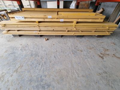 a close up of a pile of wooden planks in a warehouse