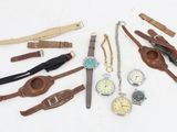 many different types of watches and watches on the table