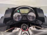 a close up of a motorcycle ' s dashboard with a speedometer
