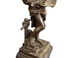 bronze statue of a man reading a book and holding a child