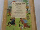 an old children ' s book with a picture of a man and a woman sitting on a bench