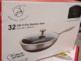 packaging of a stainless steel frying pan on display in a store