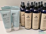 several bottles of skin care products are lined up on a table