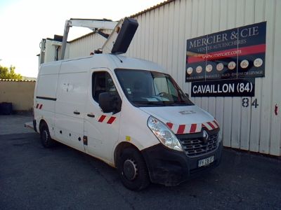 a white van that is parked in front of a building
