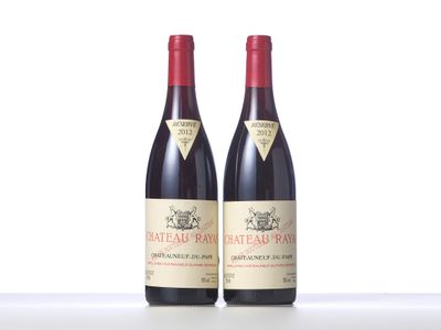 two bottles of red wine sitting next to each other on a table