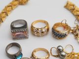 a lot of different rings and bracelets on the table