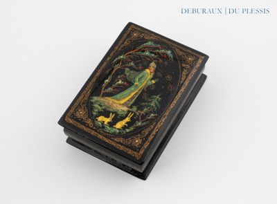a black box with a painting of a woman and a bird on it