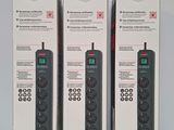 three boxes of remote controls sitting on top of a table