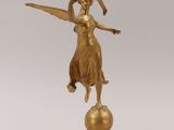 an image of a statue of a woman holding a baseball bat