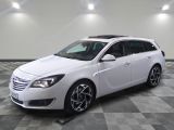a picture of a white car parked in a garage