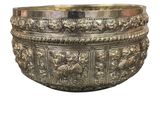 silver plated bowl with elephants and flowers on it