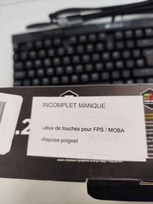 a box with a keyboard and a computer mouse in it