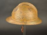 a helmet on a stand on a black background
