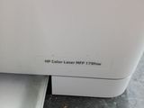 a white dishwasher sitting on top of a counter