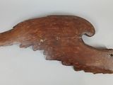 a close up of a piece of wood with a bird on it