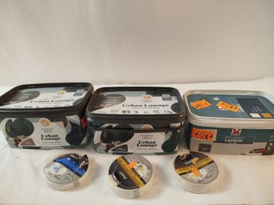four containers of ice cream sitting on a table with labels on them