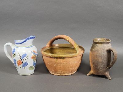 three different types of pottery sitting on a table next to each other