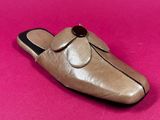 brown leather slippers with a bow on each side