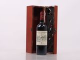 a bottle of wine in a wooden box on a table