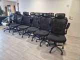 rows of office chairs lined up in a row in an empty room