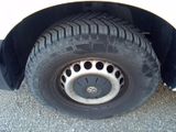a close up of a tire on the side of a truck