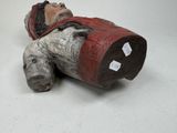 a figurine of a man laying on the ground