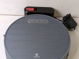 an image of a robotic vacuum cleaner sitting on top of a counter