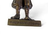 a bronze statue of a man holding a baseball bat
