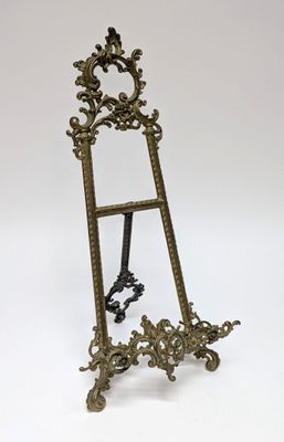 a gold easer with a mirror on it