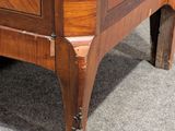 a wooden cabinet with a mirror on top of it