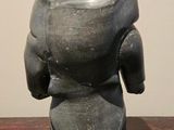 a statue of an elephant that is sitting on a table