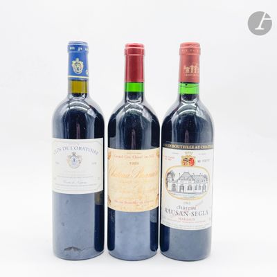 trois bouteilles de vin posées l'une à côté de l'autre sur une table