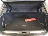 the trunk of a car with a book in the trunk